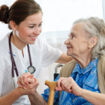 Senior woman with her home caregiver